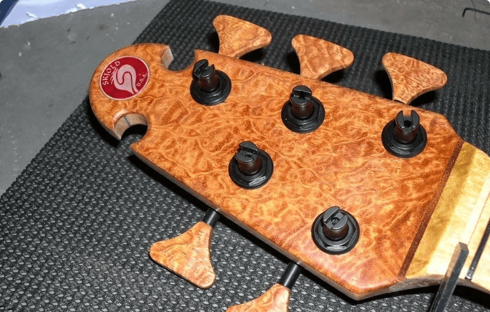 Detailed guitar headstock on a mat