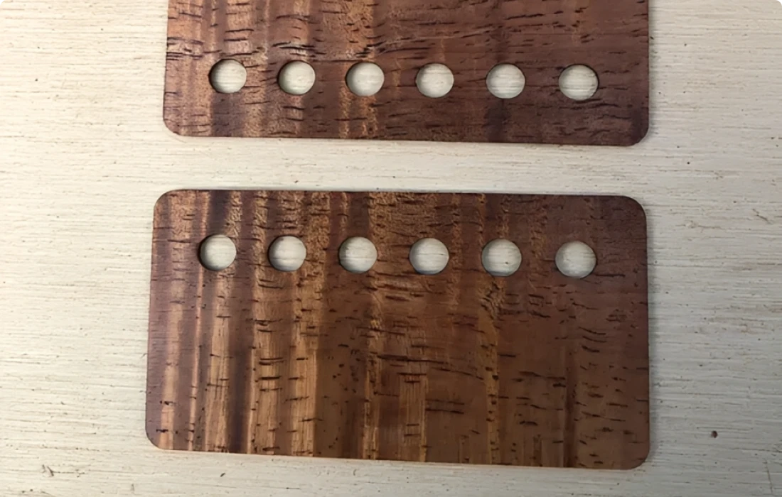 Two wooden cards with holes